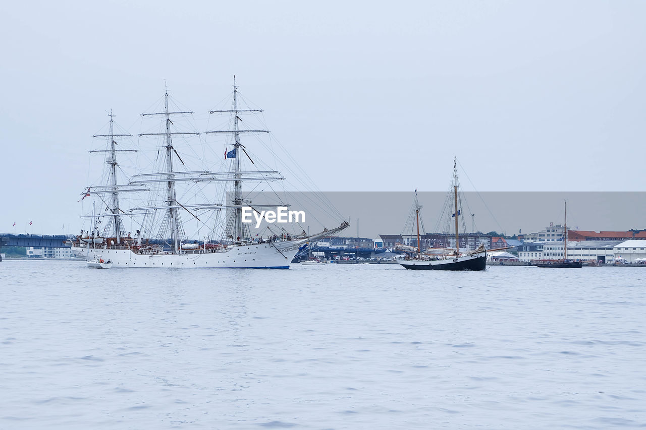 Boats sailing at harbor