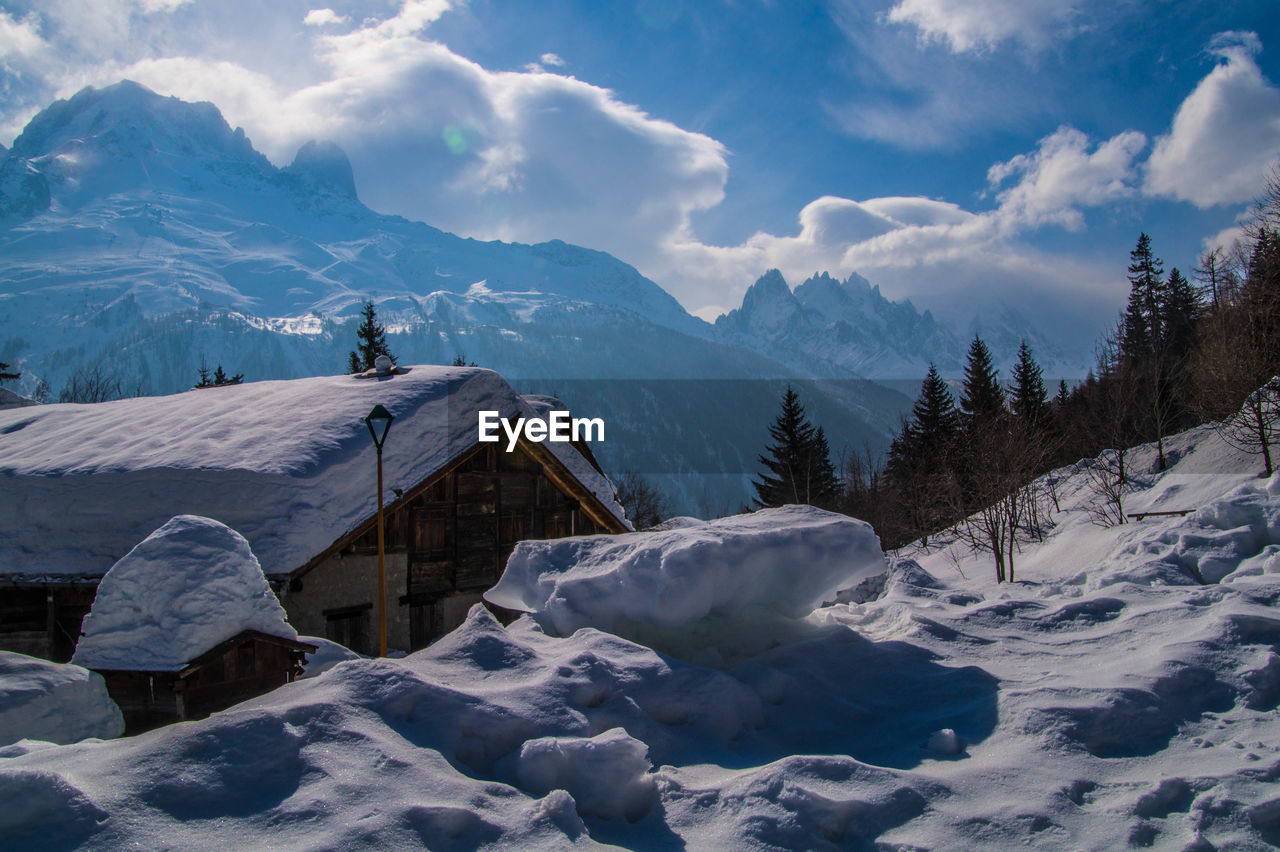 Scenic view of snowcapped mountains against sky