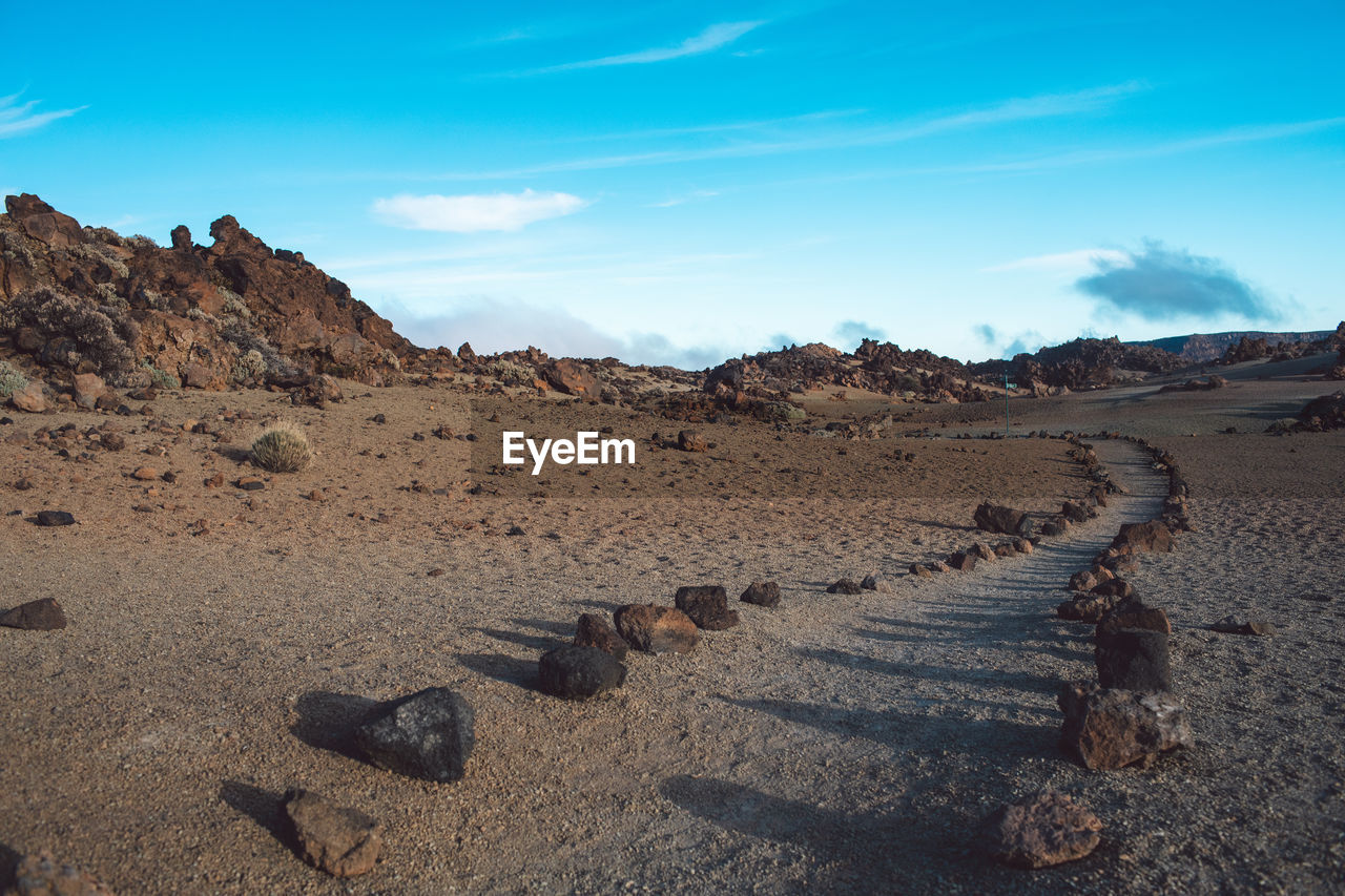 Panoramic view of rocks on land against sky