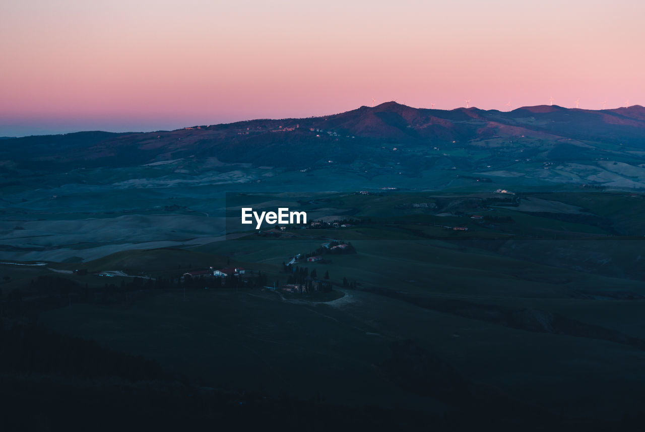 SCENIC VIEW OF LANDSCAPE AGAINST SKY AT SUNSET