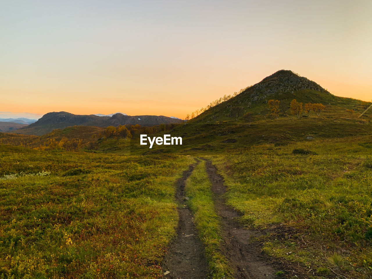 Scenic view of landscape against sky during sunset