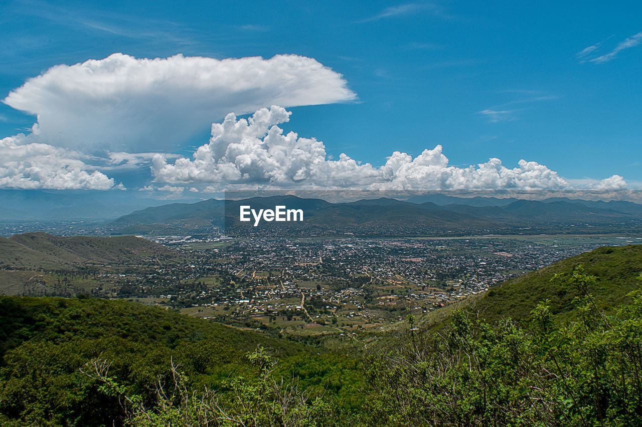 Aerial view of townscape against sky