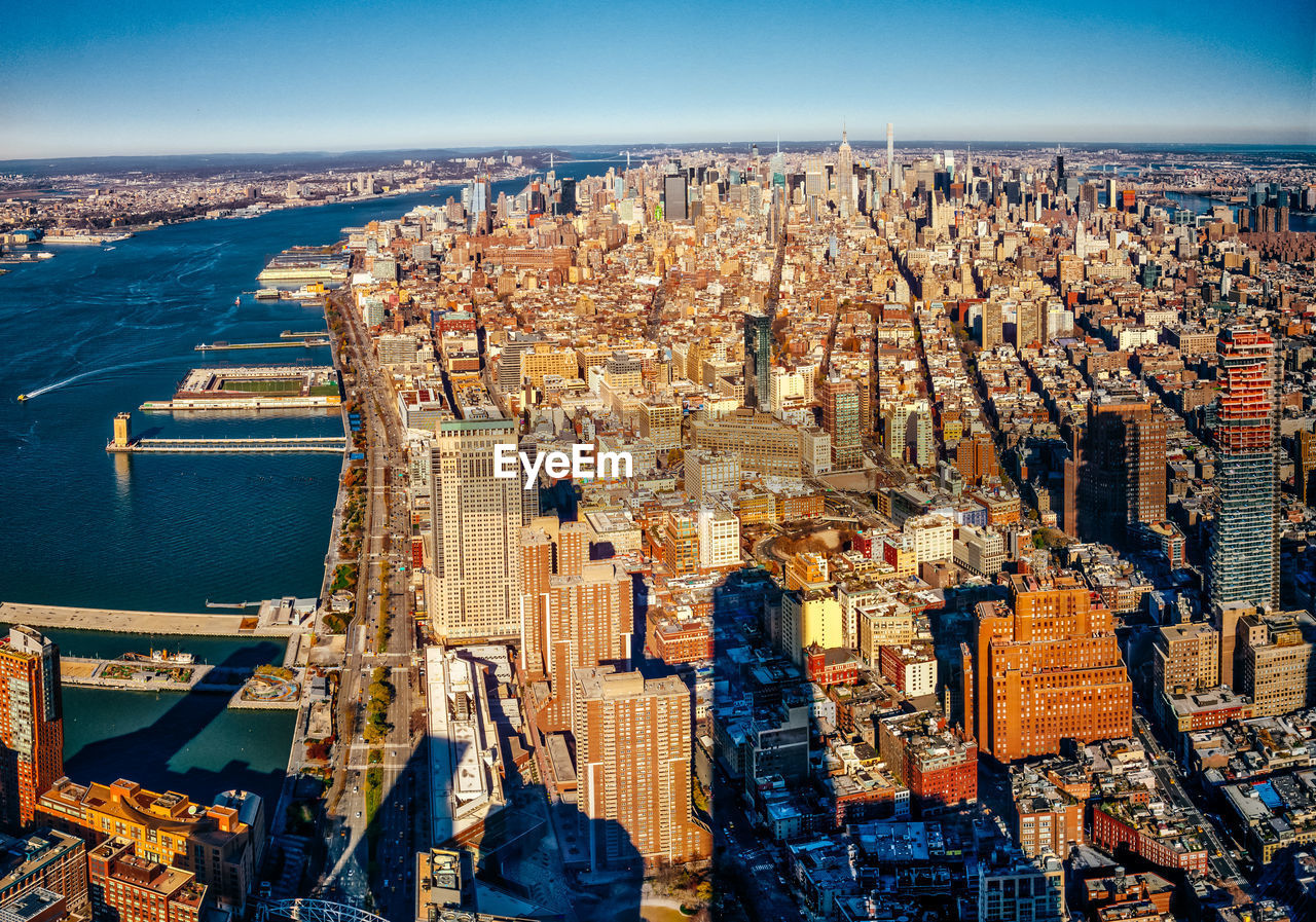 HIGH ANGLE VIEW OF CITY AT WATERFRONT