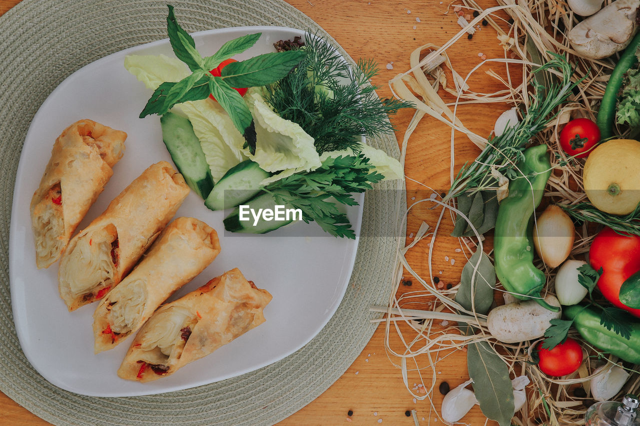 High angle view of vegetables in plate on table