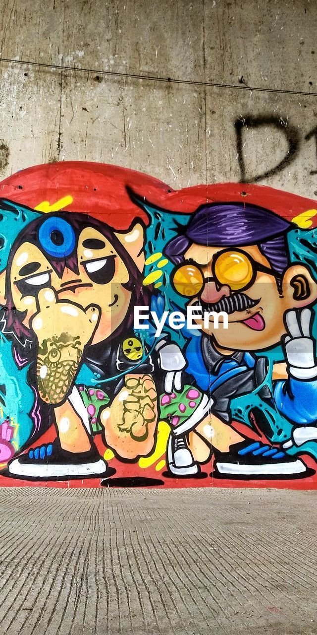 CLOSE-UP OF GRAFFITI WALL