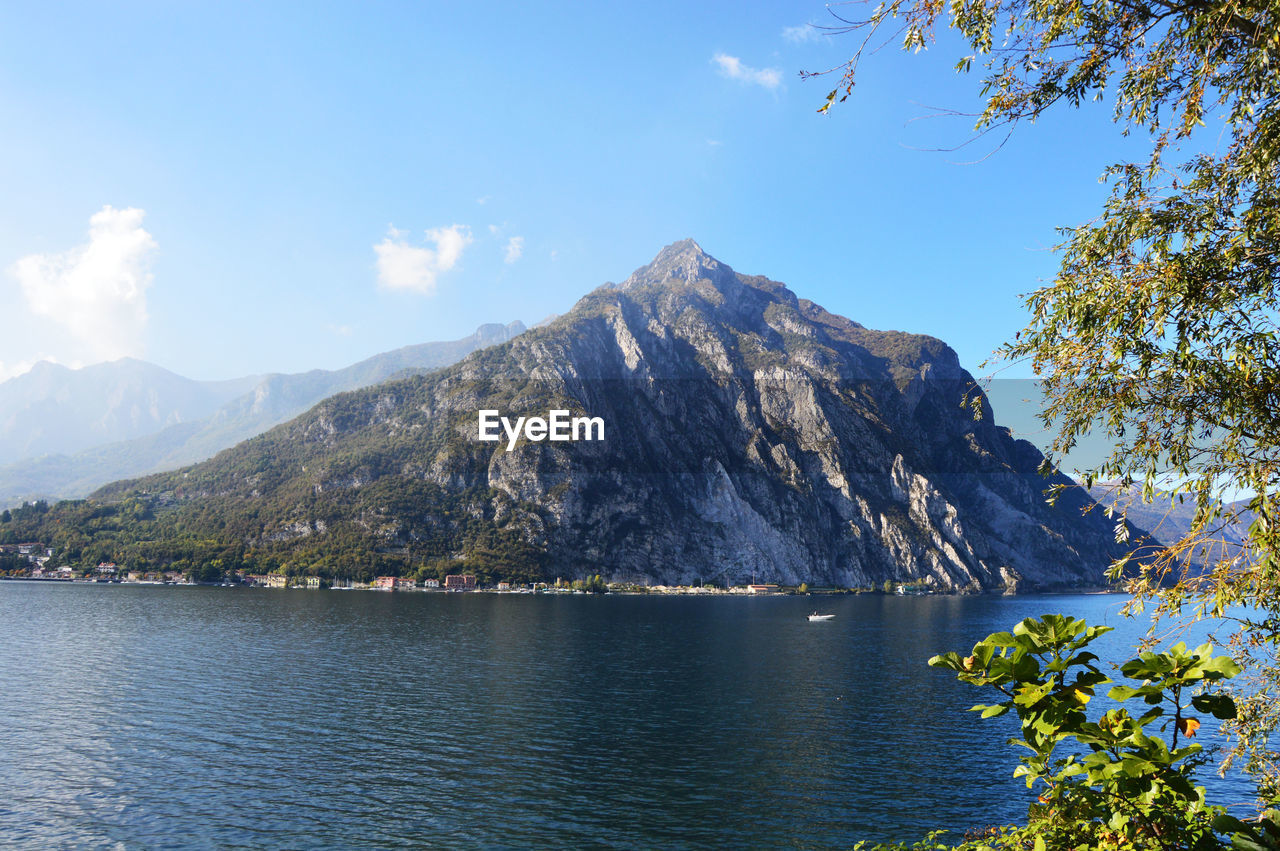 Scenic view of lake and mountains against sky