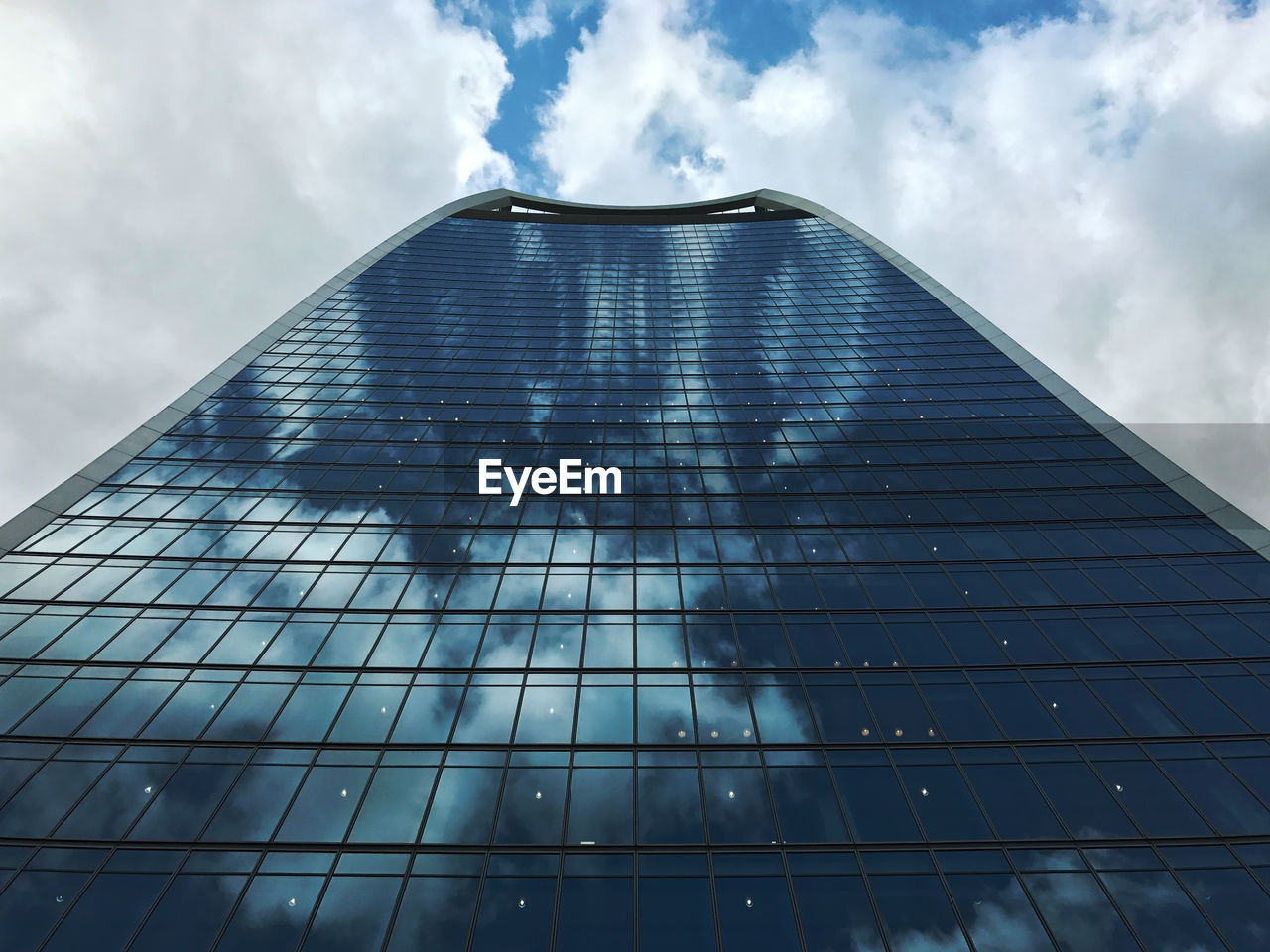 Low angle view of skyscraper against sky