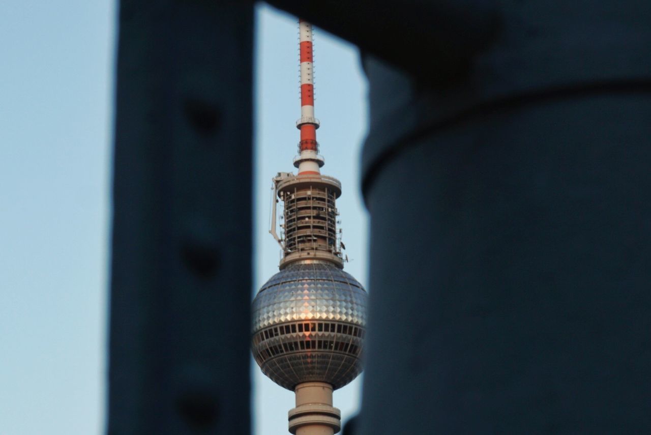 LOW ANGLE VIEW OF COMMUNICATIONS TOWER AGAINST SKY