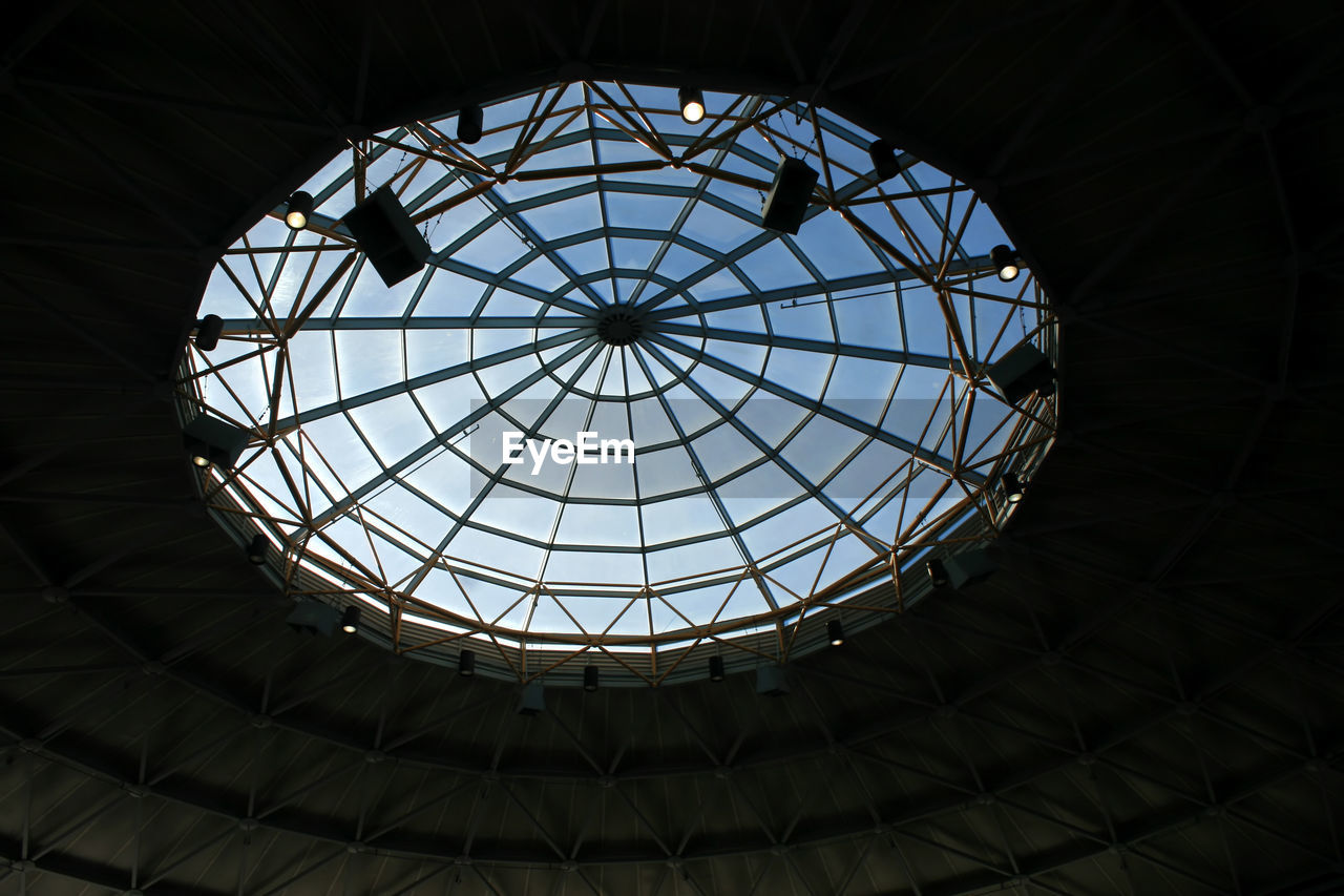 A large window in a roof with a geometric pattern