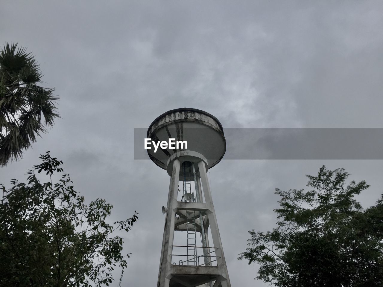 LOW ANGLE VIEW OF WATER TOWER ON CLOUDY SKY