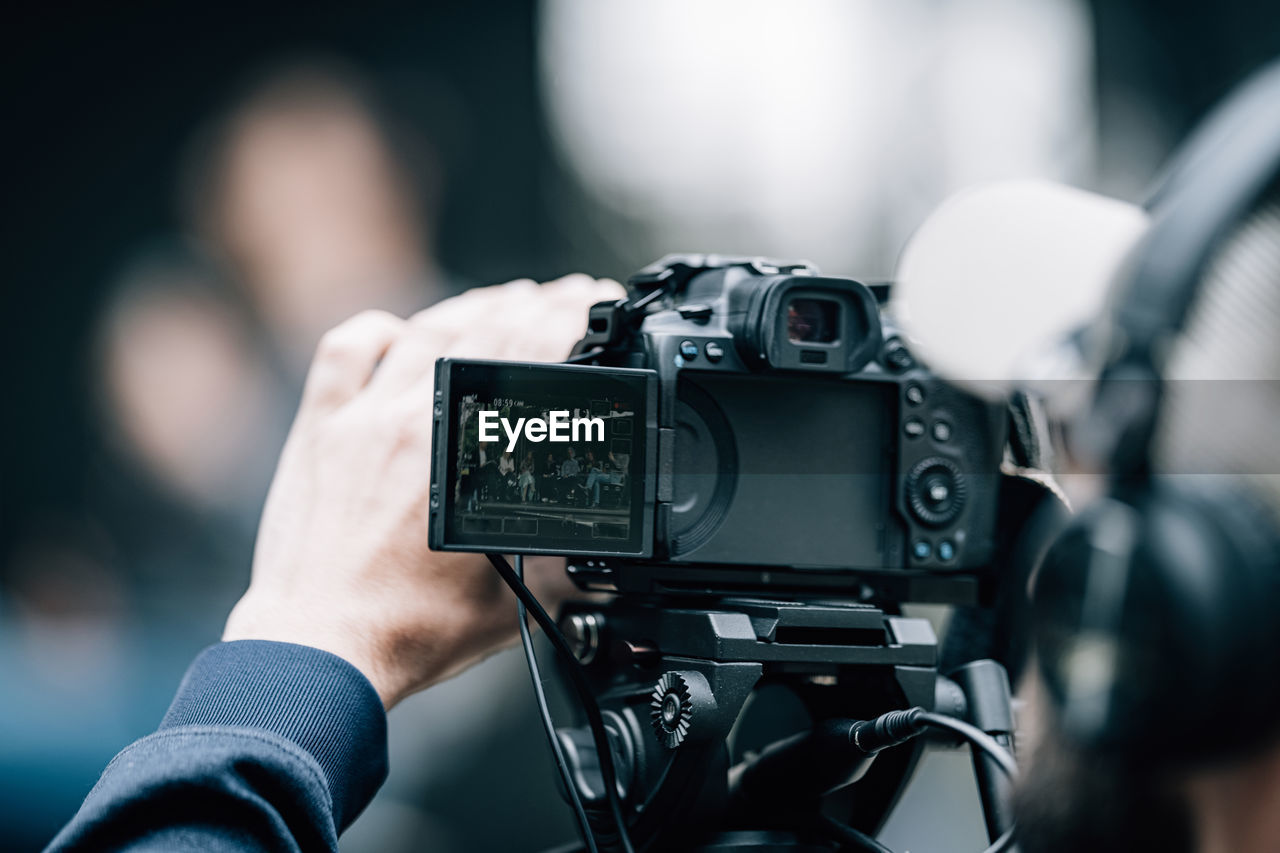 Camera at a panel discussion conference