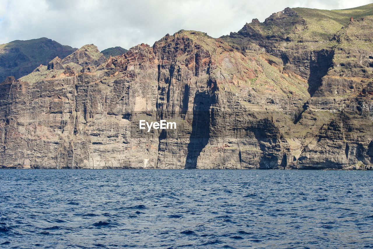 View on the steep coast of los gigantes on canary island tenerife with rocks in different colors