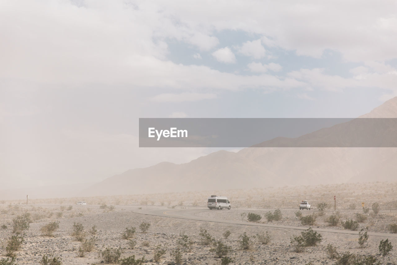 Scenic view of death valley against sky during sandstorm