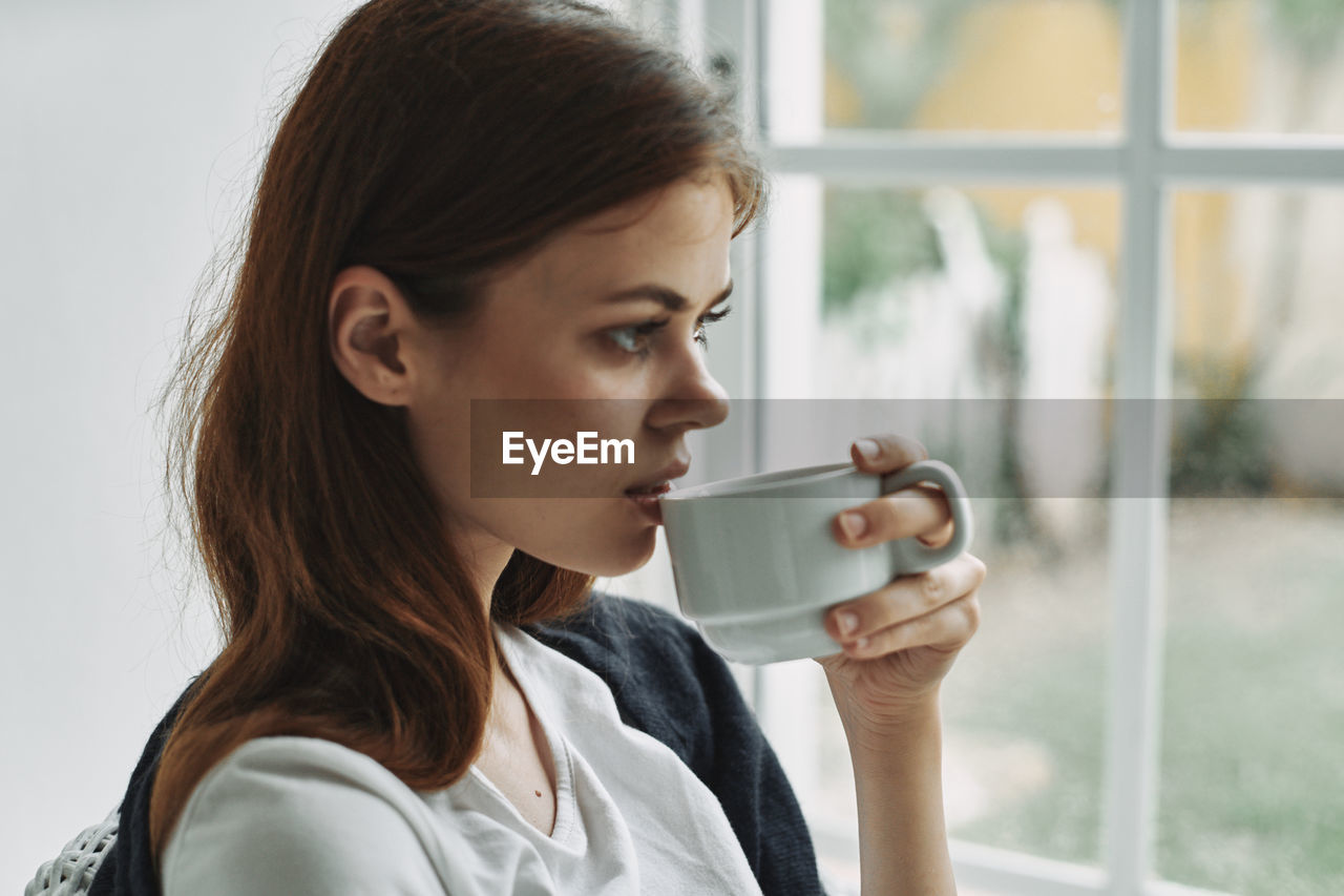 Close-up of woman drinking coffee