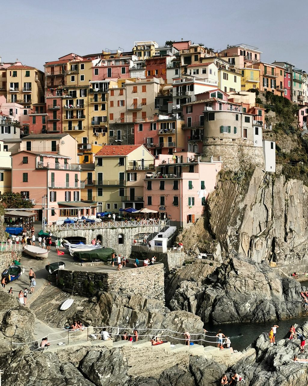 High angle view of buildings by sea against sky