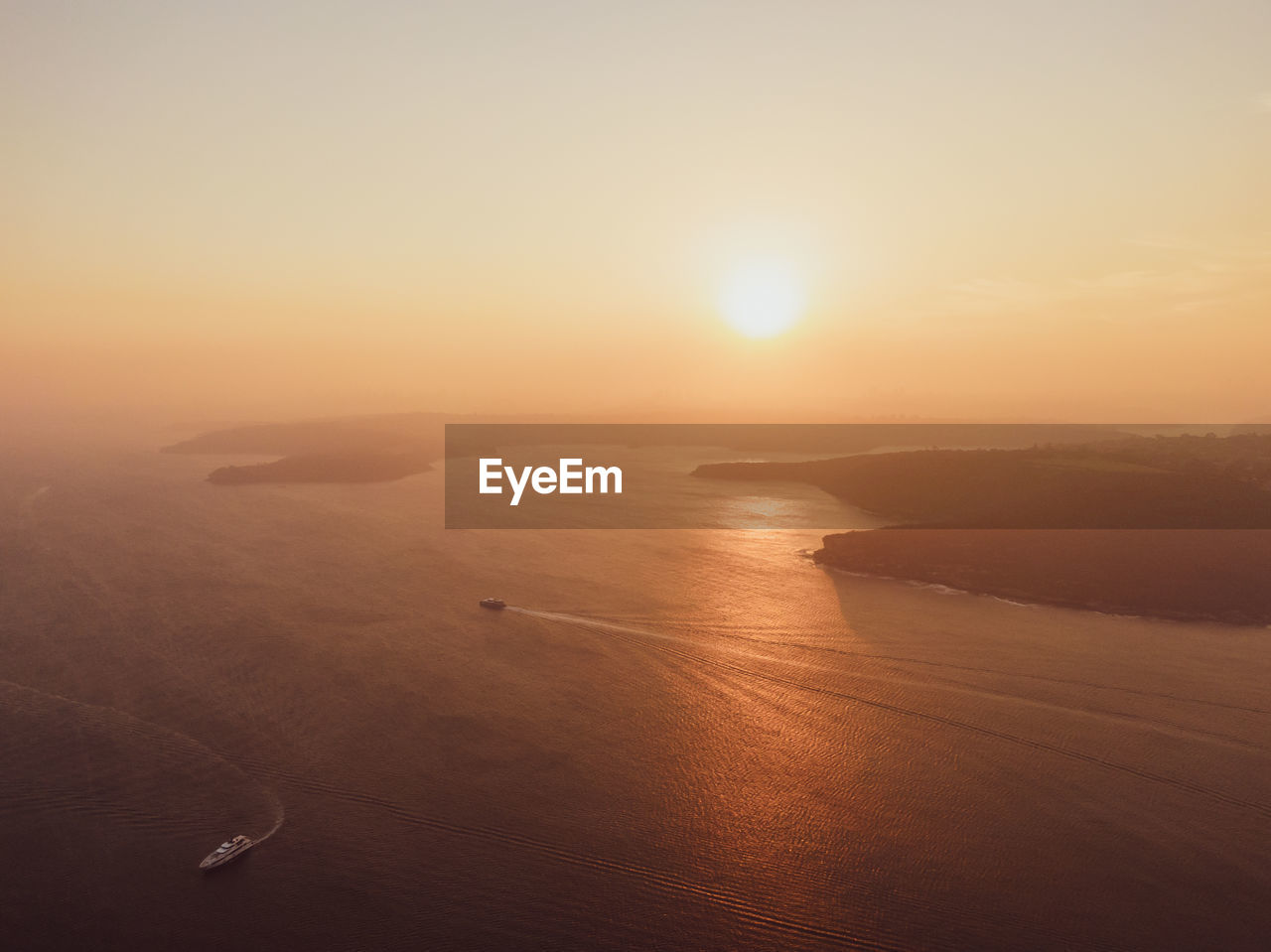 Drone sunset view of sydney harbour, australia. the air is full of haze and smoke from bushfires