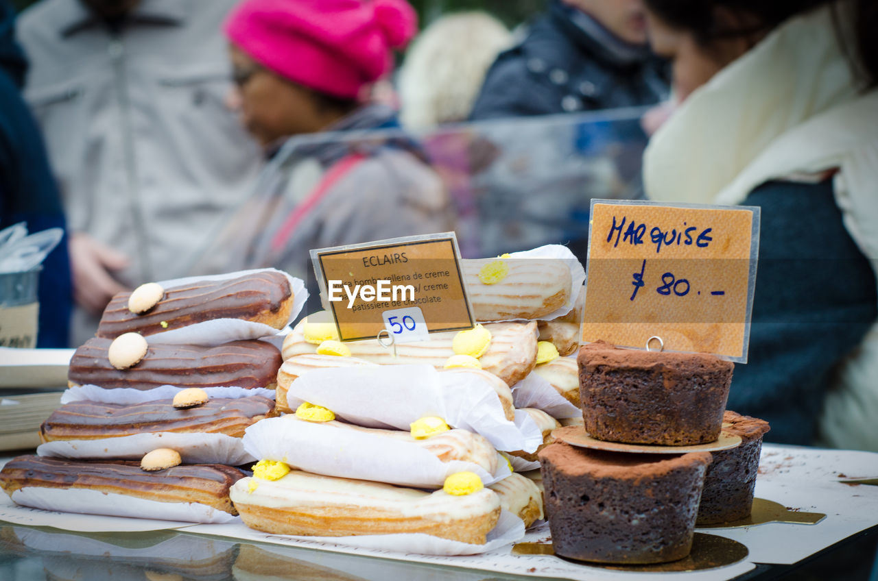 Close-up of chocolate desserts with labels at market stall