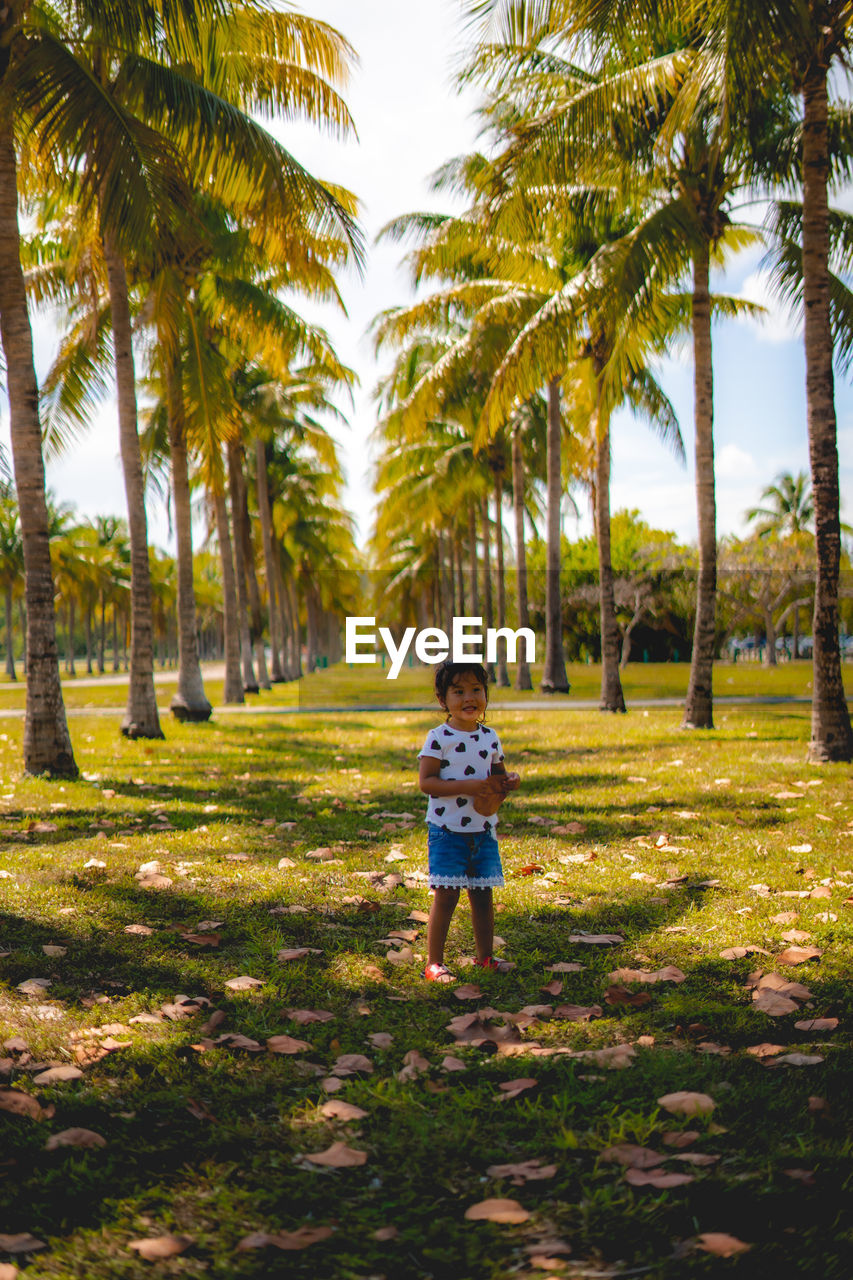 Front view of girl standing at park