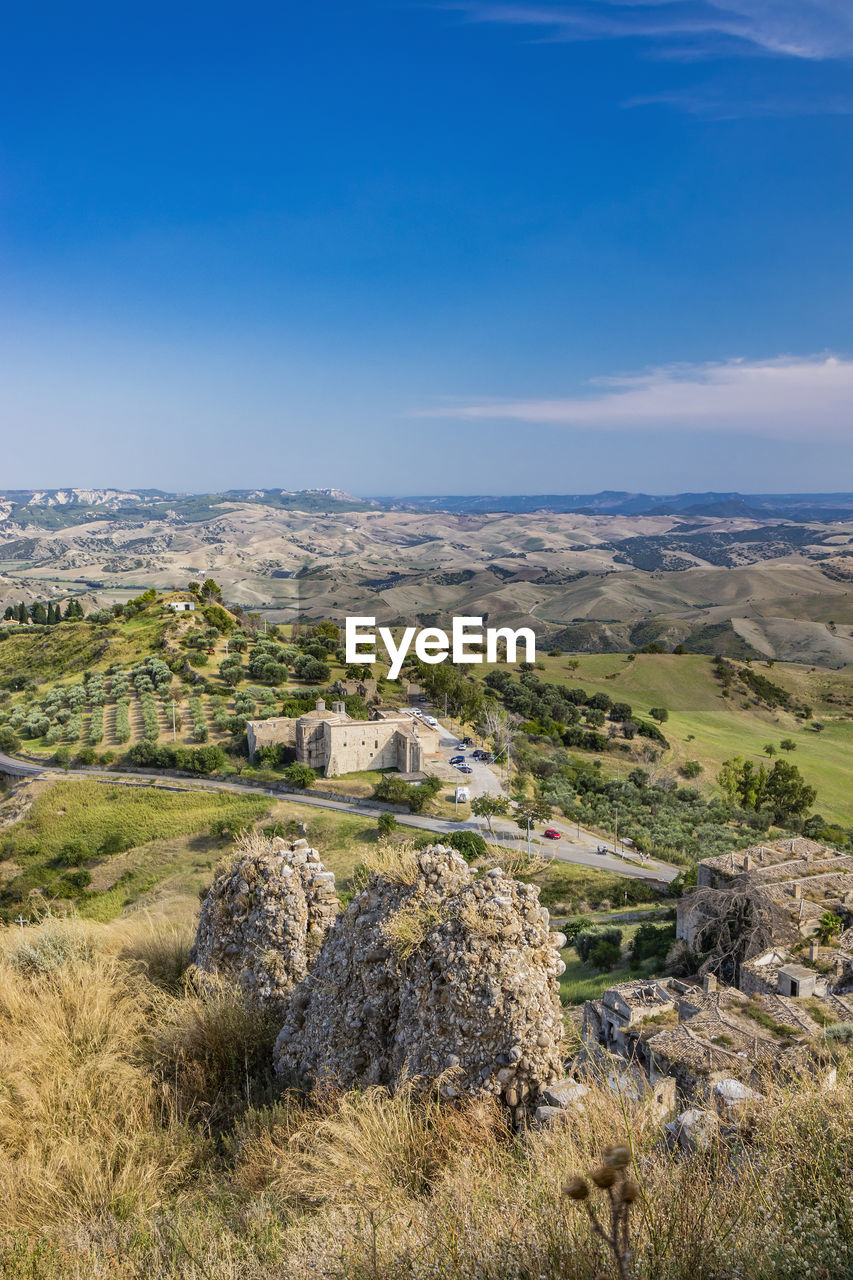 SCENIC VIEW OF LANDSCAPE AND BUILDINGS AGAINST SKY