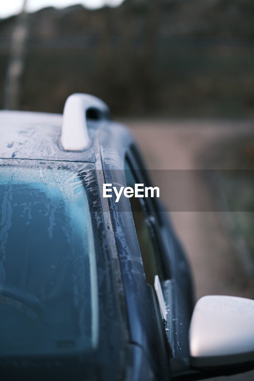 CLOSE-UP OF VINTAGE CAR ON MIRROR