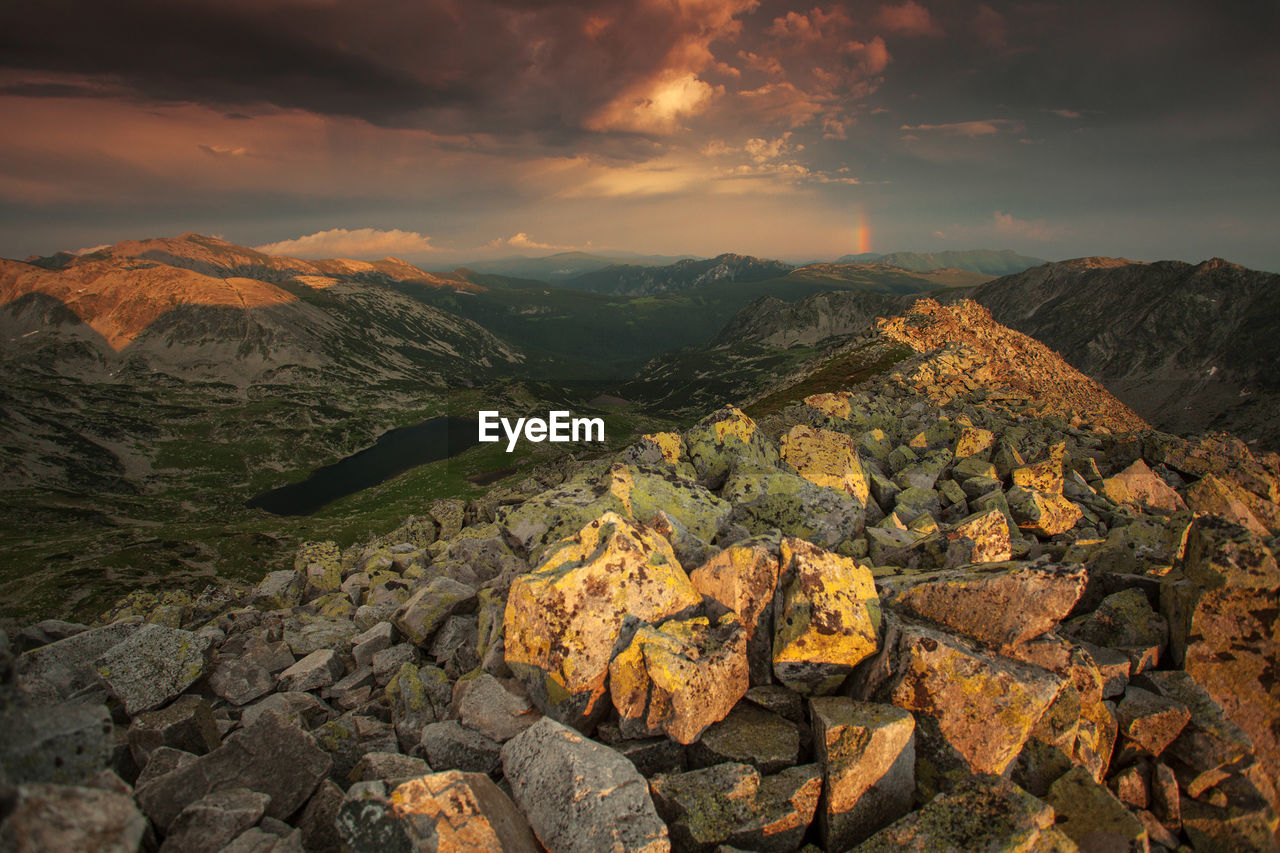 Aerial view of rock formation against sky during sunset