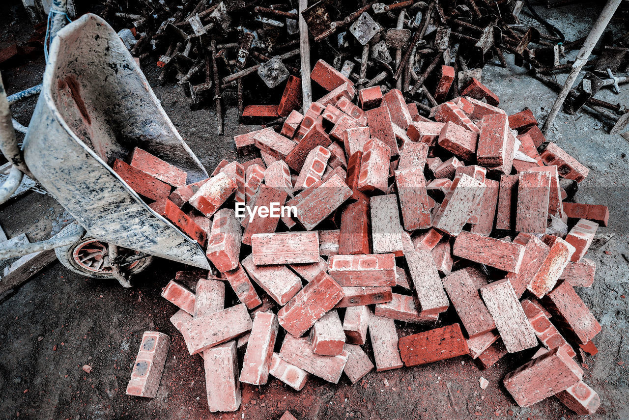 High angle view of bricks on field at construction site