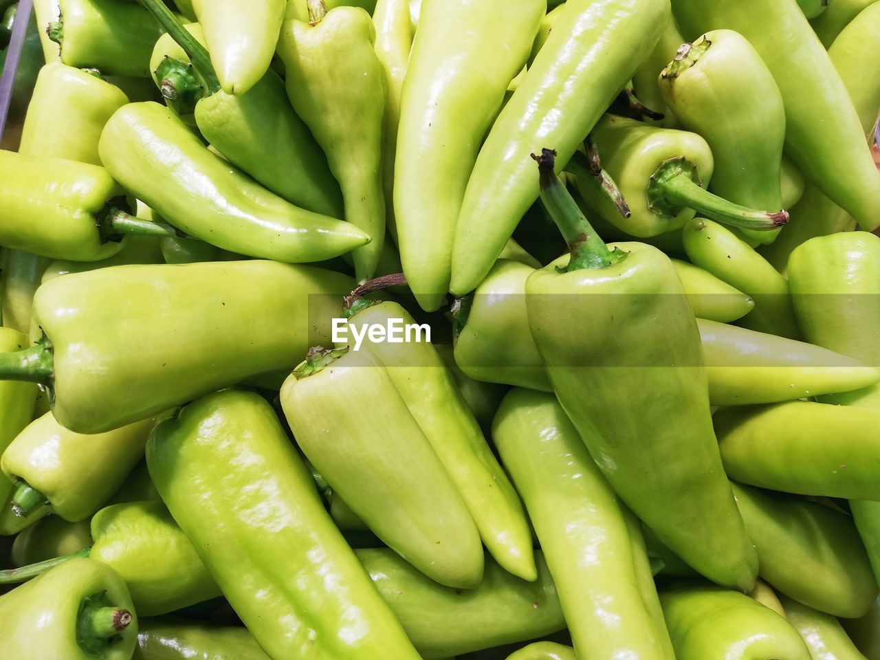 FULL FRAME SHOT OF GREEN CHILI PEPPERS FOR SALE