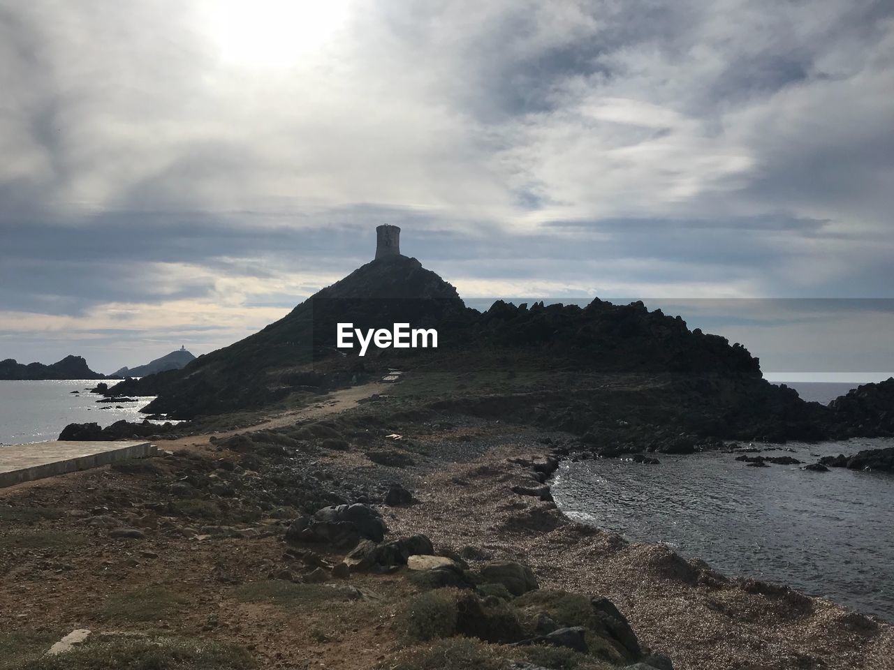 SCENIC VIEW OF MOUNTAIN AGAINST CLOUDY SKY