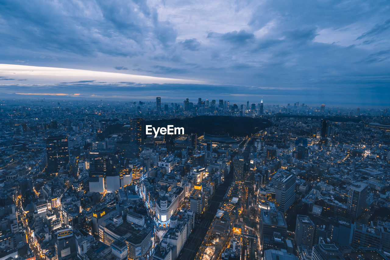 high angle view of city buildings against sky