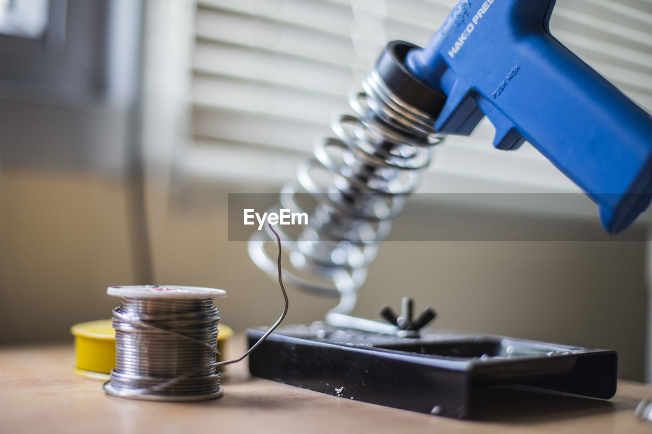 Soldering iron on table