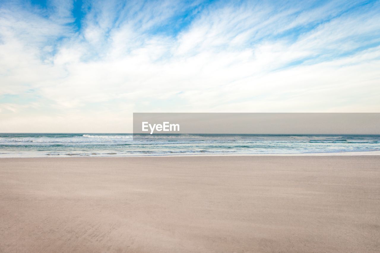 Scenic view of beach against sky