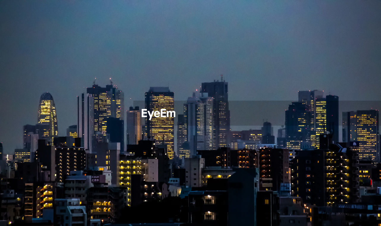Illuminated buildings in city at night