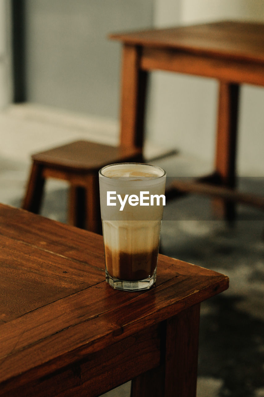 Coffee milk on wooden table