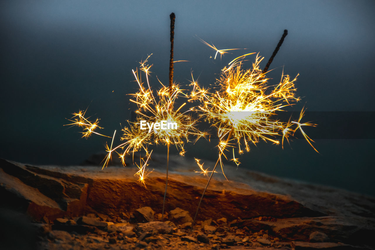 Sparkler on ground at night