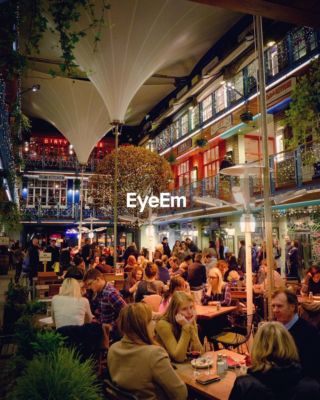 Crowd at restaurant in city during night