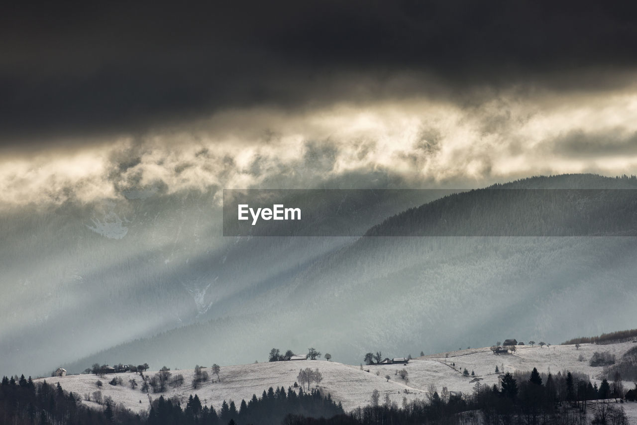 Scenic view of snowcapped mountains against sky