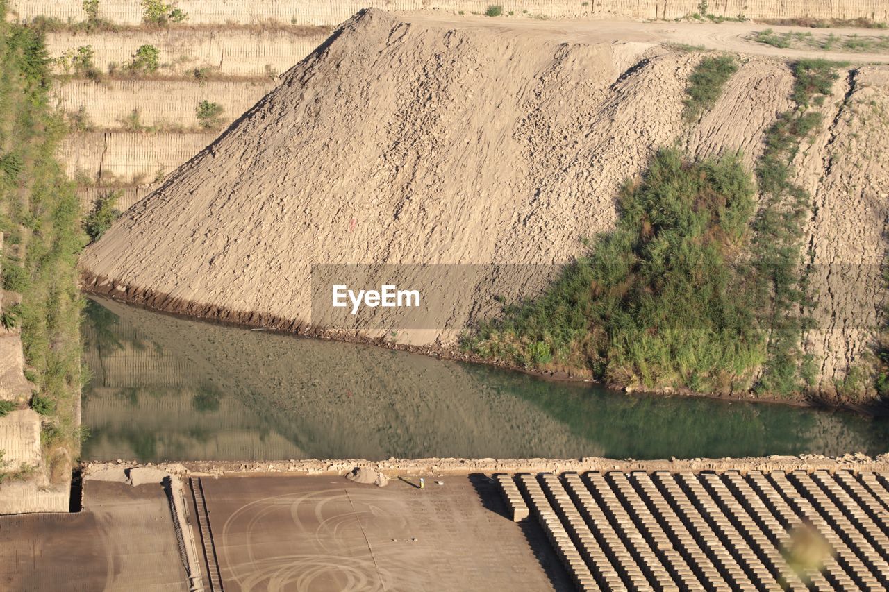 HIGH ANGLE VIEW OF DAM ON ROOF
