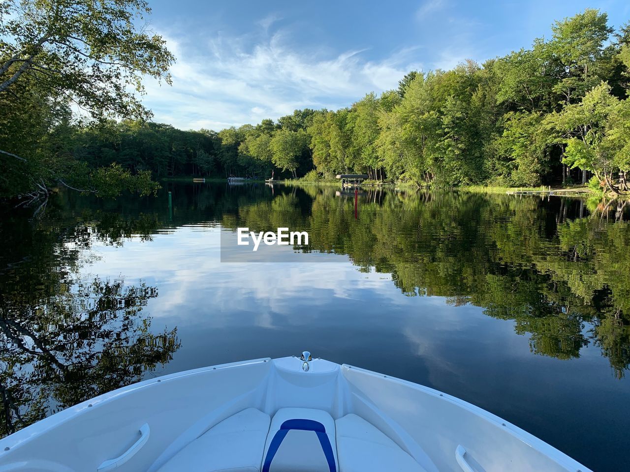 SCENIC VIEW OF LAKE AMIDST TREES AGAINST SKY