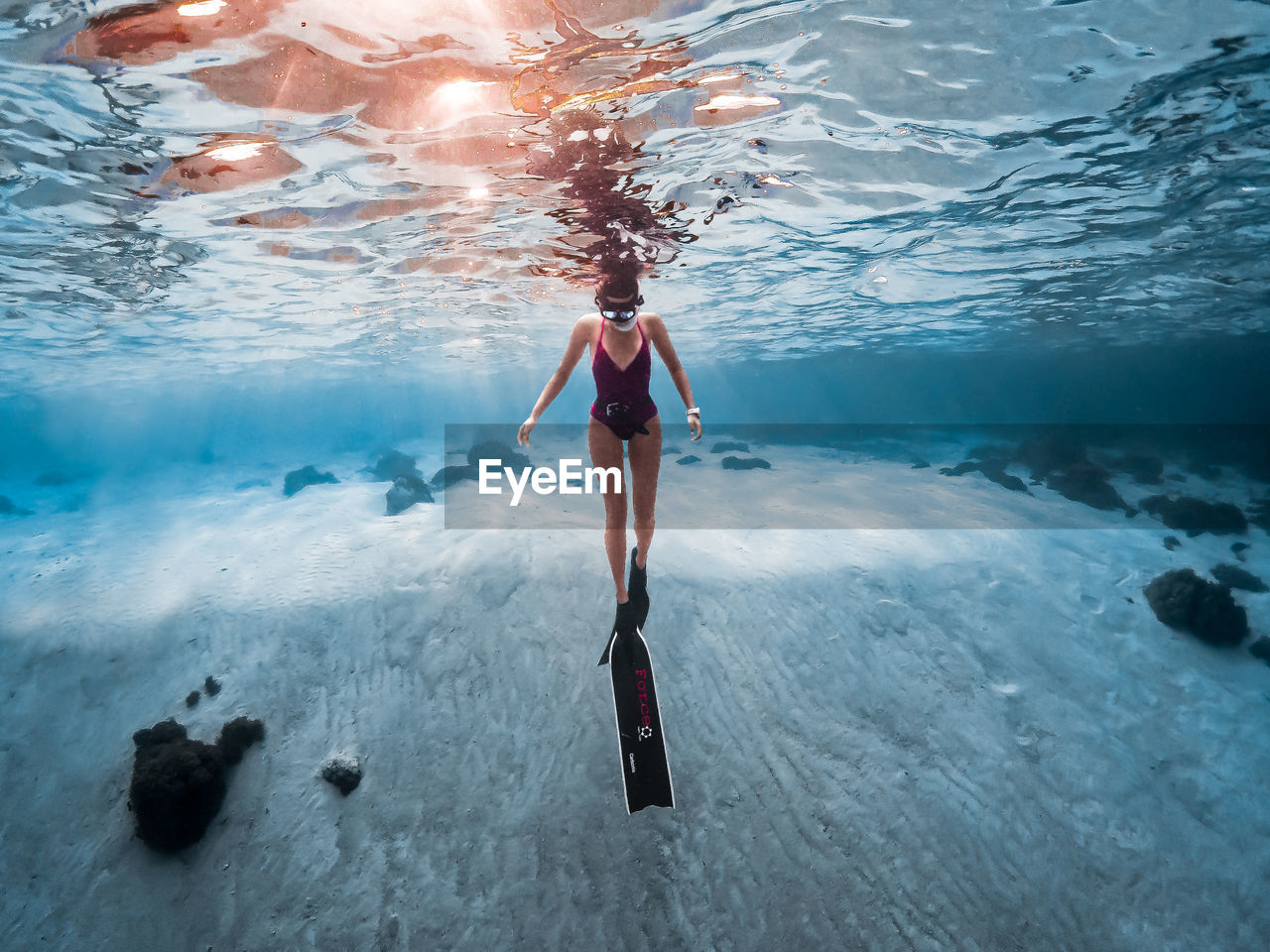 WOMAN SWIMMING IN SEA