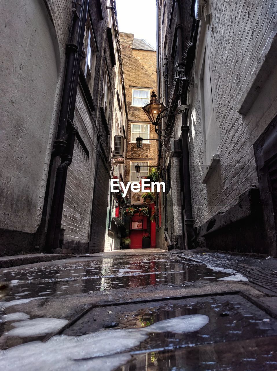 NARROW WALKWAY ALONG BUILDINGS