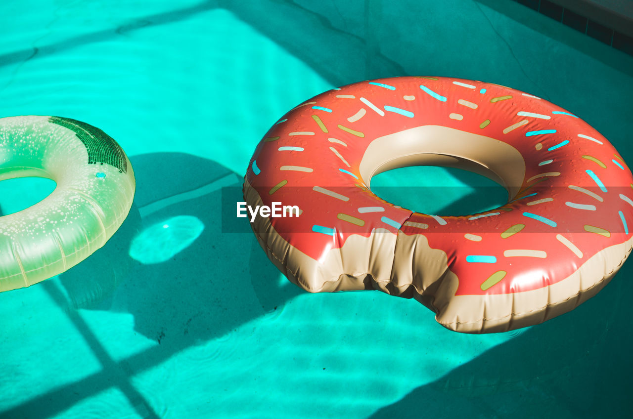 Close-up of inflatable ring floating in swimming pool