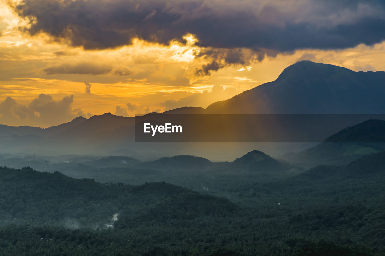 Scenic view of mountains against sky during sunset