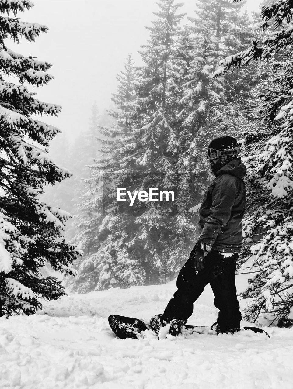 Man standing on snow covered land