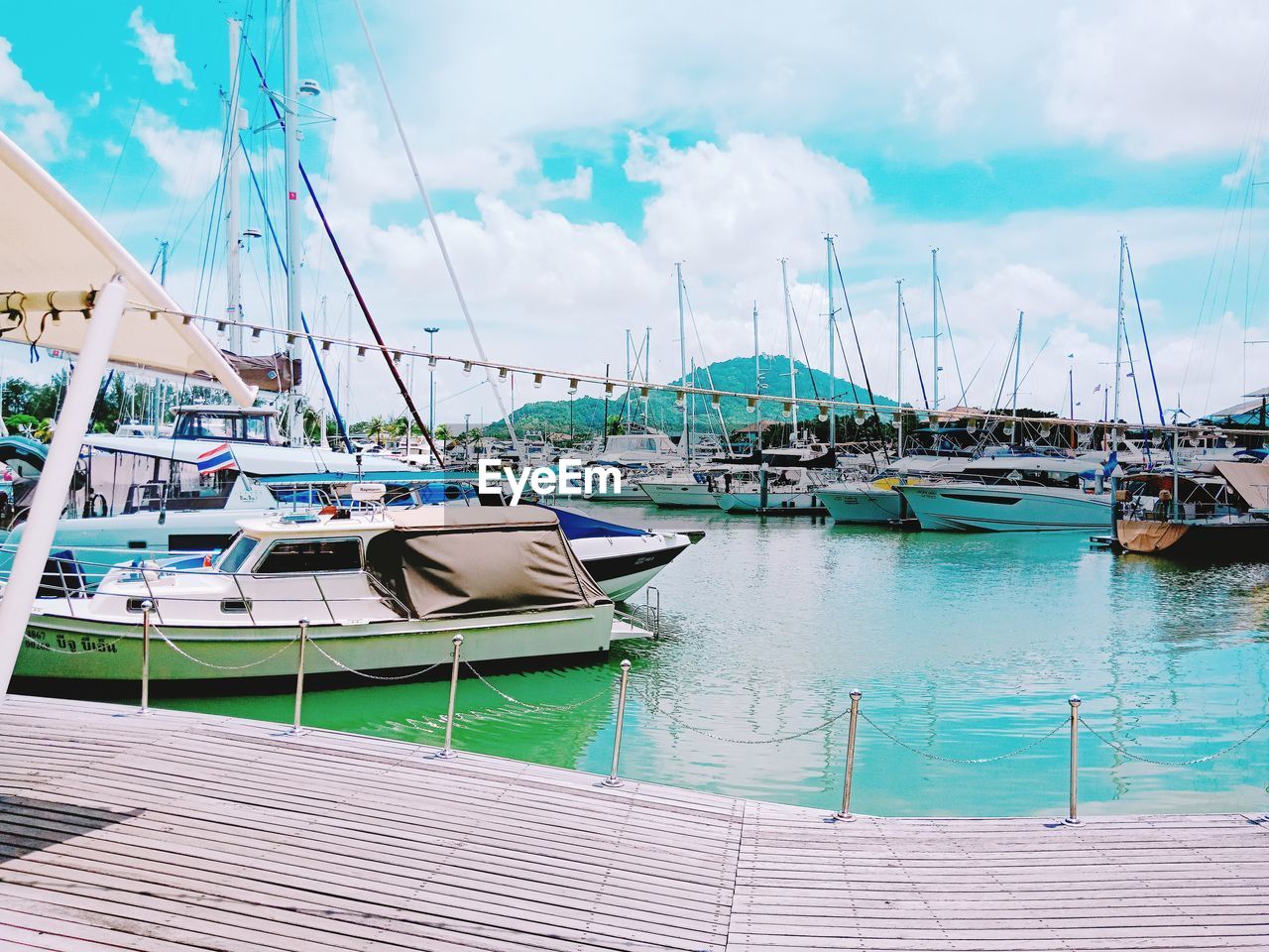 Boats moored at harbor