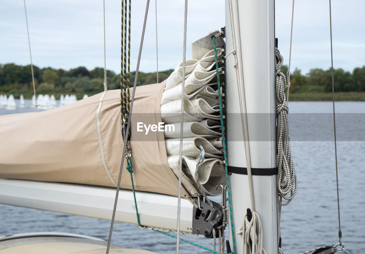 Close-up of sailboat on sea