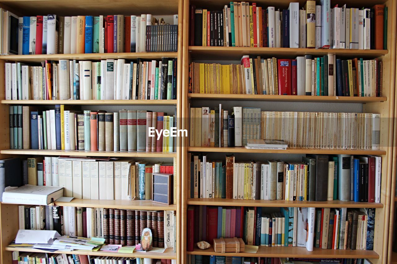 BOOKS IN SHELF AT HOME