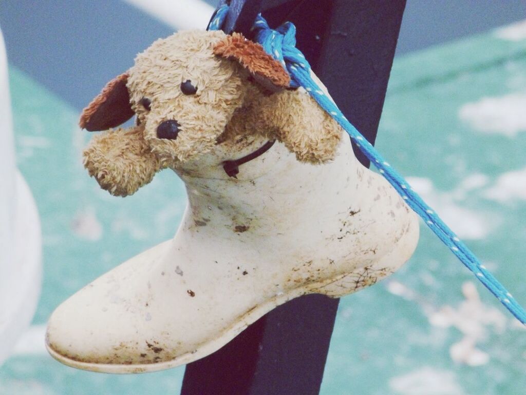 Close-up of stuffed toy in boot