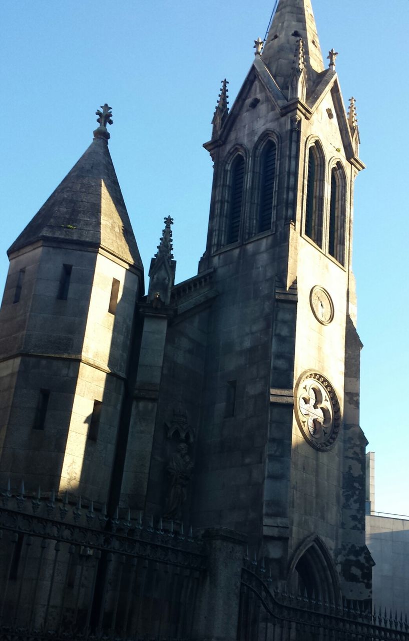 LOW ANGLE VIEW OF CHURCH WITH CHURCH IN BACKGROUND