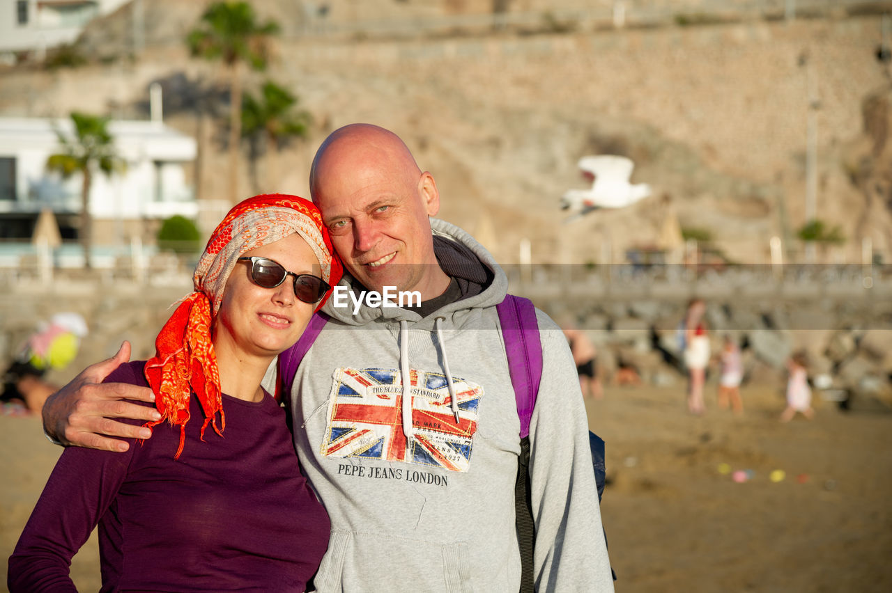 February 4 2022-mature couple poses on the beach in puerto rico canary island