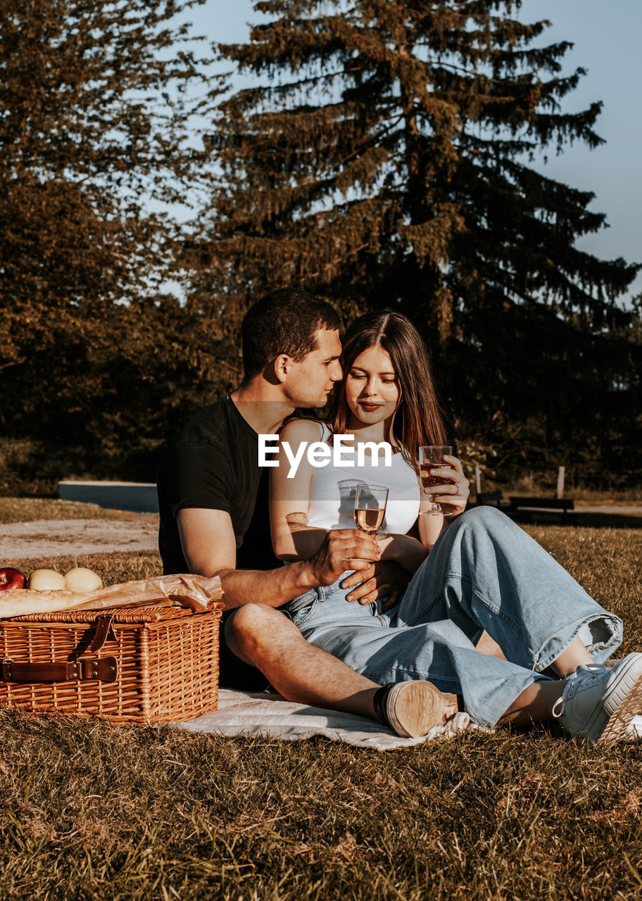 Young couple having a picnic in the park.